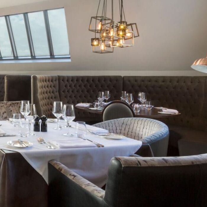 table, chairs and lighting for hotel dining