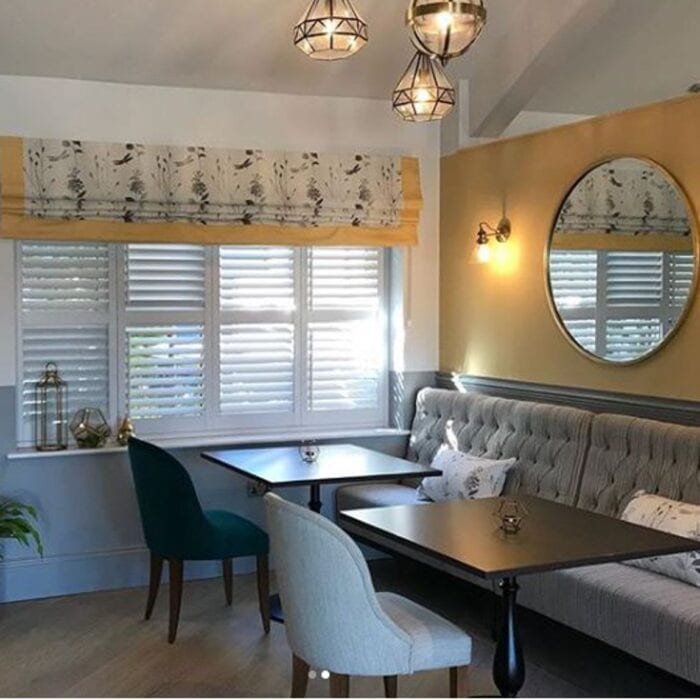 sleek seating area in tea room with banquette