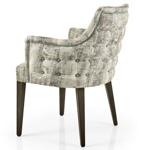 side view of hanna dining armchair with buttoned outer back